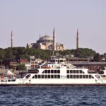 A ferry on the Bosphorus with the Sultanahmet skyline in Istanbul