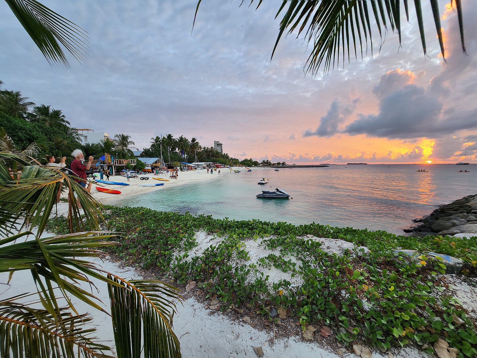 Water sports and boats on the beach at Maafushi in the Maldives