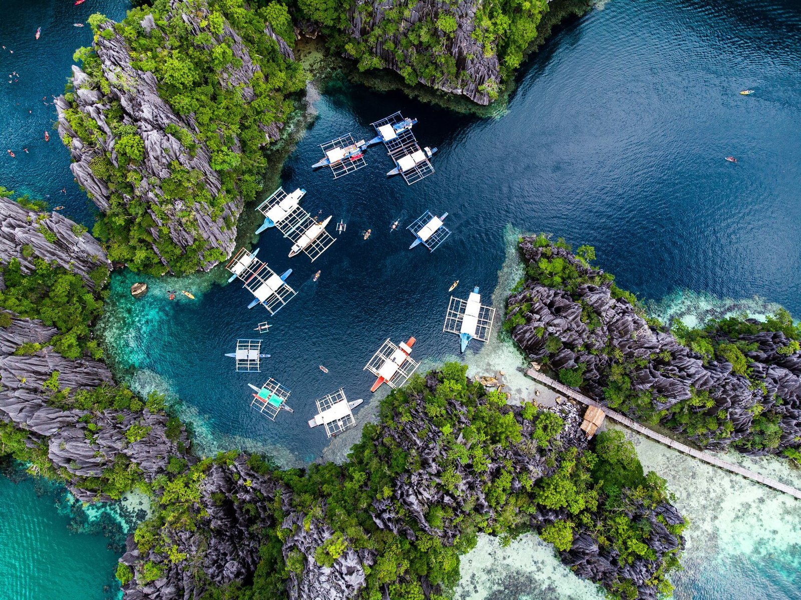 Kayaks on a limestone lagoon during a Palawan itinerary