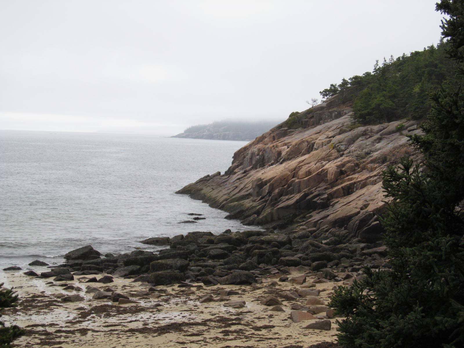 Sand Beach between granite cliffs in Acadia National Park, Maine